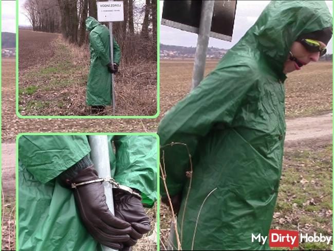 In the raincoat and wellies handcuffed to iron bar